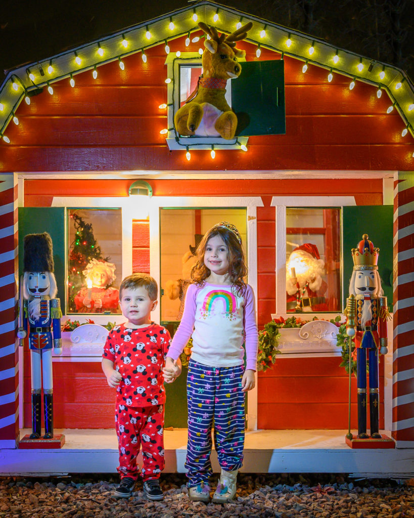 Tabi and Ace in front of a Christmas light display around our neighborhood. Photo by Fred Crowden